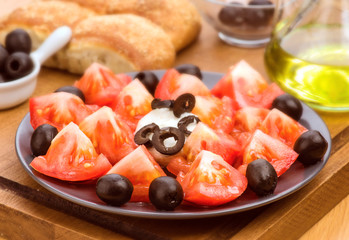 salad with tomato and cheese, selective focus