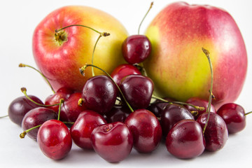 Red fresh cherries and apples