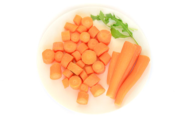 Fresh carrot on a white plate isolated on white background