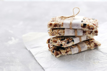 Granola bar on a grey table, close up