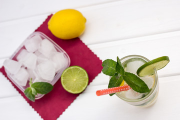Homemade cool lemonade on white wood