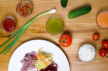 Vegetable snacks with sauces on a wooden table