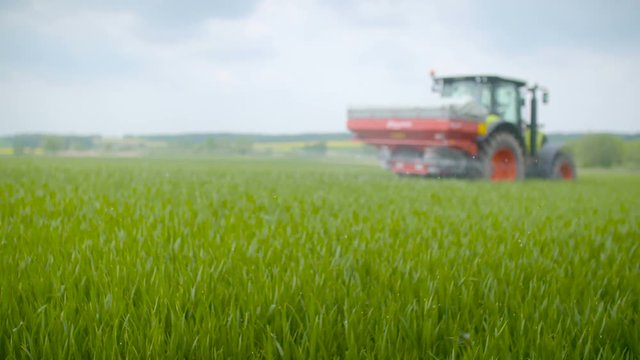 Tractors sprayed with fertilizer