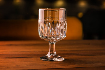 Empty glass on table in night club