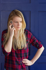 Pretty Woman Calling Someone Through Mobile Phone While Smiling