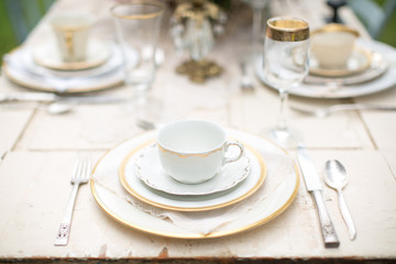 Place settings on table, outdoors