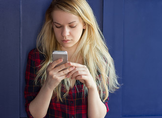 Cute Girl playing with her Phone