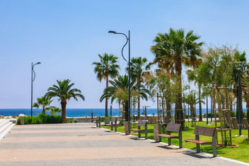 Coastline and promenade in Limassol, island Cyprus, Europe, Mediterranean Sea. Bright sunny day and blue water and sky.