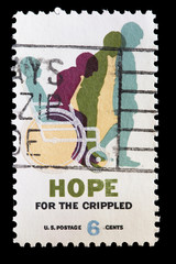 United States used postage stamp showing crippled in wheelchair