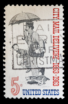 United States used postage stamp showing city mail delivery postman