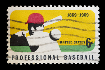 United States used postage stamp showing a professional baseball player