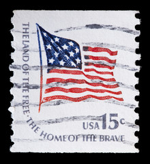 United States used postage stamp showing flapping flag of USA