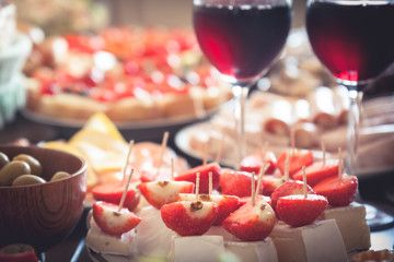 table served with appetizers in the form of canapes and glasses of wine in the restaurant