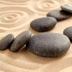Fotobehang Zen Stenen Close up of zen garden with group of black stones  © exclusive-design