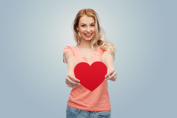 happy woman or teen girl with red heart shape