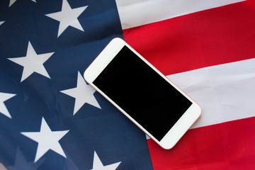 close up of smartphone on american flag
