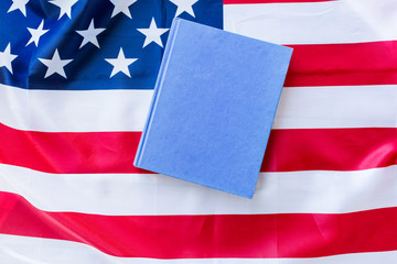 close up of american flag and book