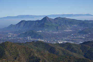 Panoramic view of Santiago, capital of Chile. Viewed from Parque Puente Nilhue in the foothills of the Andes Mountains looking towards Cerro Manquehue (1,635m).
