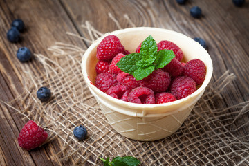 Raspberries in a waffle bowls.