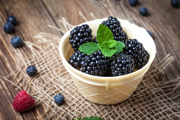 Blackberries in a waffle bowls.