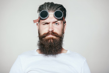 Bearded man in pilot glasses