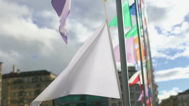 Closeup of white banner, cloudy blue sky background, symbol of war and peace