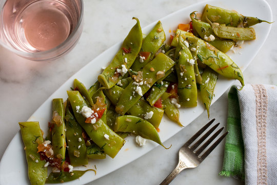 Stewed romano beans with tomatoes and dill