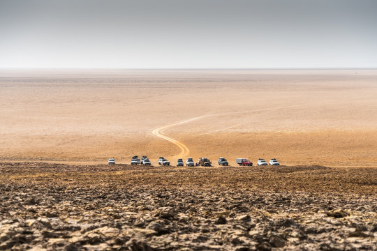 Vehicles parked side by side in desert