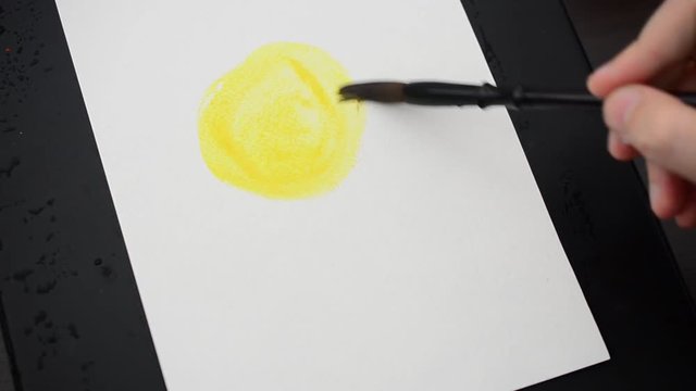 We draw the sun. We draw water color paints.