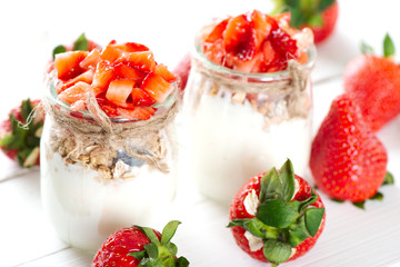 Strawberries desert with cream and cereals