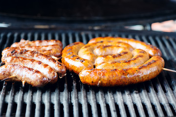Grilled sausages on the grill