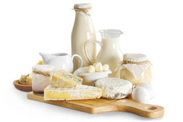 Set of fresh dairy products on wooden board, isolated on white