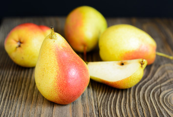 Ripe pears in a wooden table