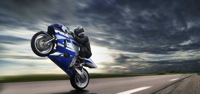Fast Wheelie On Blue Motorbike © adcdsb