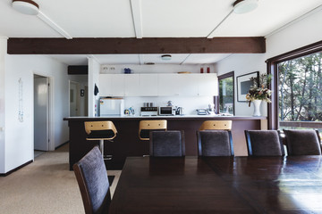 Kitchen and dining area of older style retro funky beach house