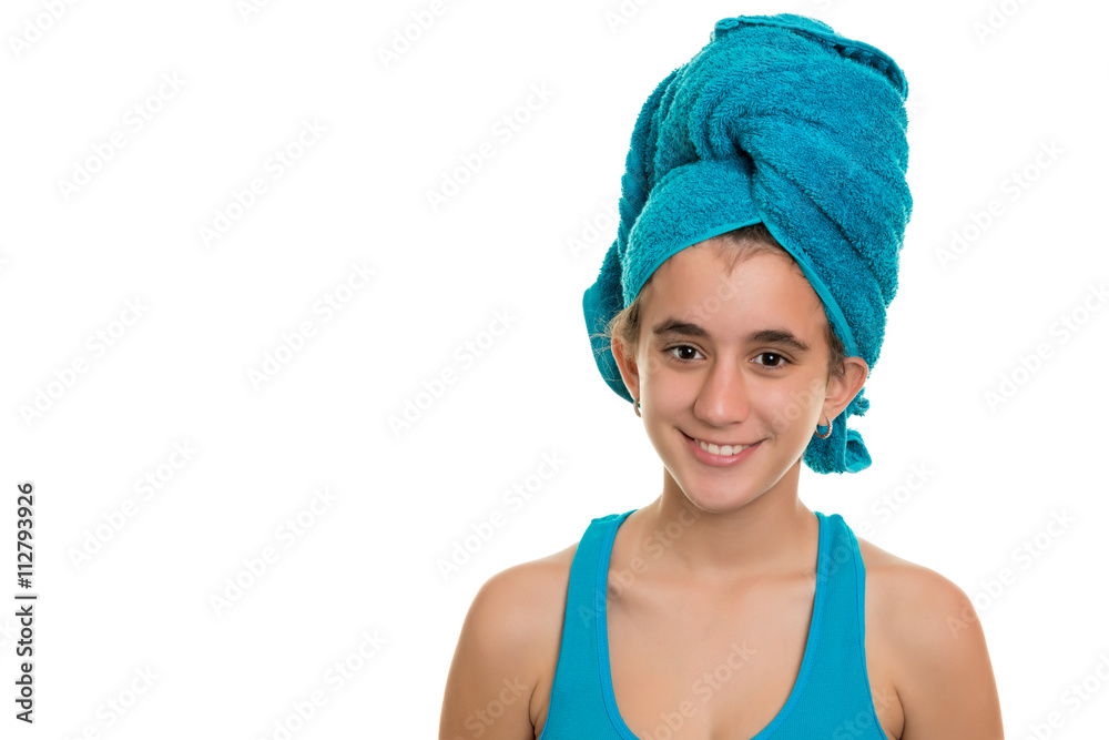 Wall mural Teenage girl with a blue towel wrapped over her wet hair