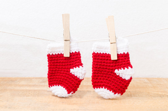 Knitted baby socks hanging on the clothesline