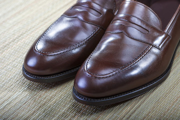 Footwear Concept and Ideas. Men's Stylish Brown Penny Loafers
