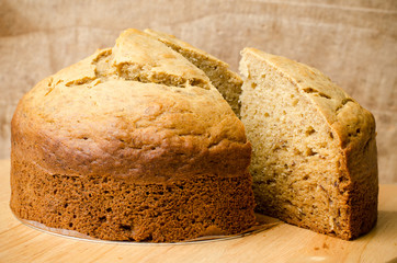 Homemade banana cake on wooden background