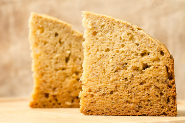 Sliced banana cake on wooden background
