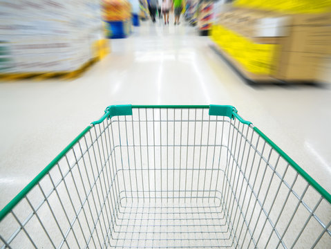 shopping cart in supermarket blur background