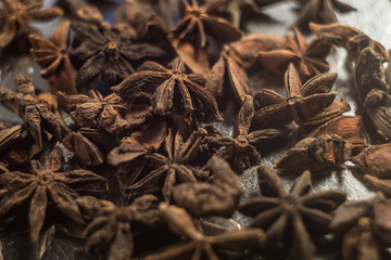 Spices. Anise stars photo. Intentionally blurred lens focus effect. Color toning.