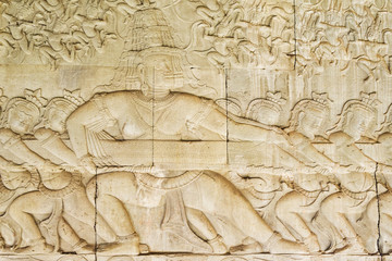 Famous bas relief carving The Churning of the Sea of Milk at Angkor Wat temple, Siem Reap, Cambodia.