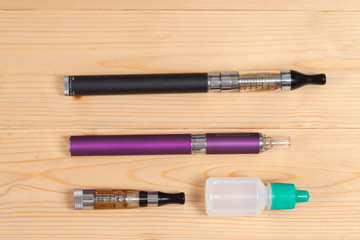 electronic cigarette  on a background of wood texture
