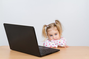  little girl at the computer.