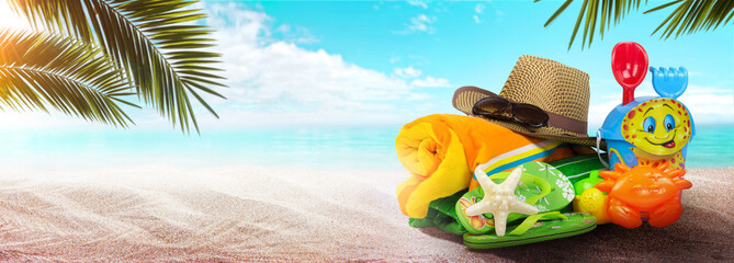 Summer background with starfish and accessories on sand beach