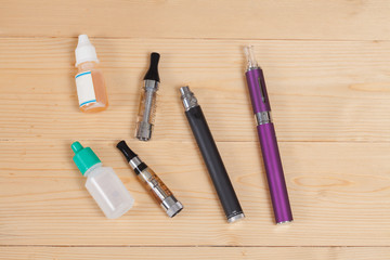 electronic cigarette  on a background of wood texture