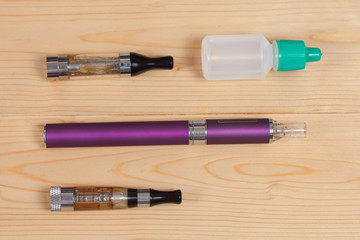 electronic cigarette  on a background of wood texture