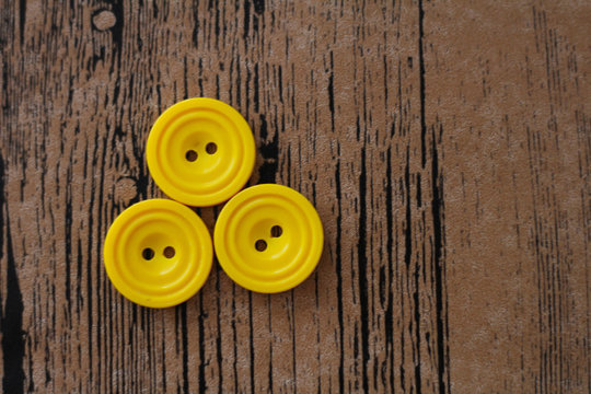 three yellow buttons