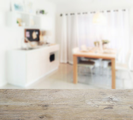 wooden table top with blur of wooden dining table next to pantry